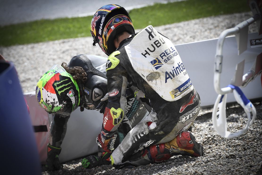 Johann Zarco checks on Franco Morbidelli after the crash. 