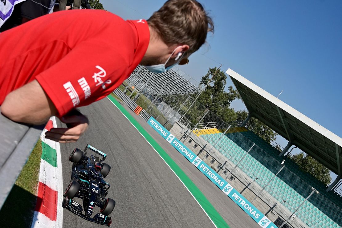 Sebastian Vettel watches rival Lewis Hamilton secure pole position.