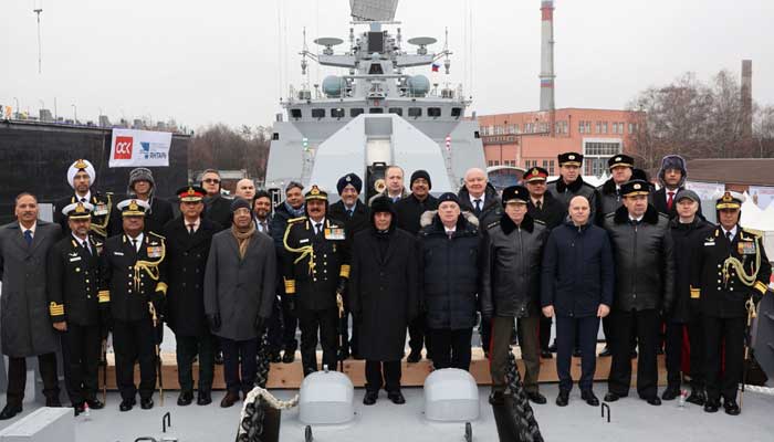 This handout photograph taken on December 9, 2024 shows Indias Defense Minister Rajnath Singh (C) posing for photographs with the Russian delegation during the commissioning ceremony of Indias latest multi-role stealth guided missile frigate INS Tushil, in the Baltic port of Kaliningrad. — AFP