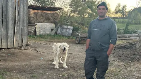 Jozsef (right) and his dog (left, name unknown)