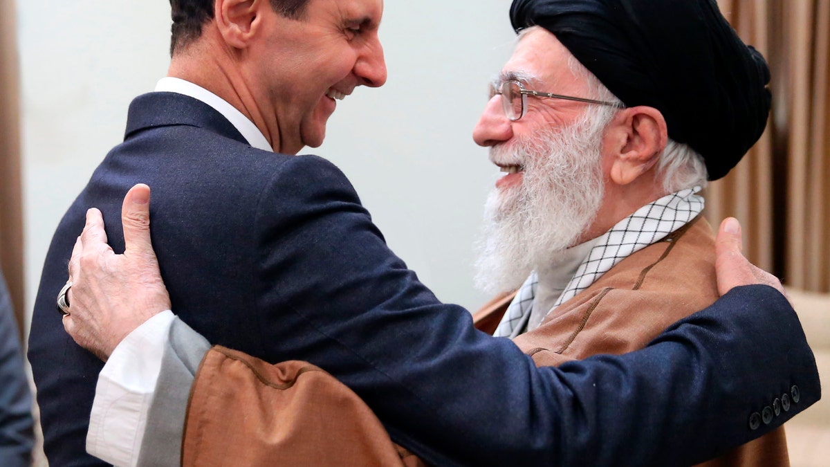 Syrian President Bashar Assad, left, and Iranian Supreme Leader Ayatollah Ali Khamenei