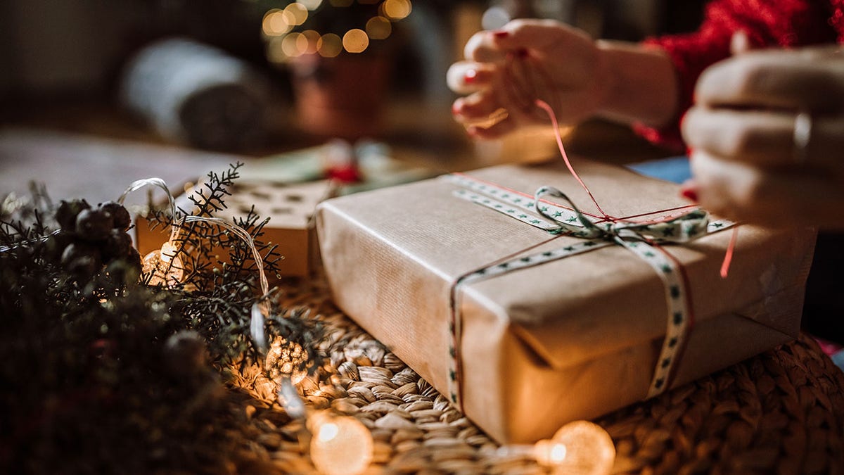 Woman Wrapping Christmas Gifts