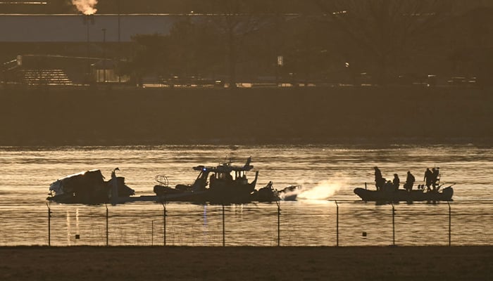 Part of the wreckage is seen as rescue boats search the waters of the Potomac River after a plane on approach to Reagan National Airport crashed into the river near Washington, DC, on January 30, 2025. — AFP