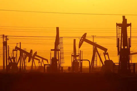 Getty Images Pump jacks are seen at dawn in an oil field over the Monterey Shale formation where gas and oil extraction using hydraulic fracturing, or fracking, is on the verge of a boom on March 24, 2014 near Lost Hills, California.