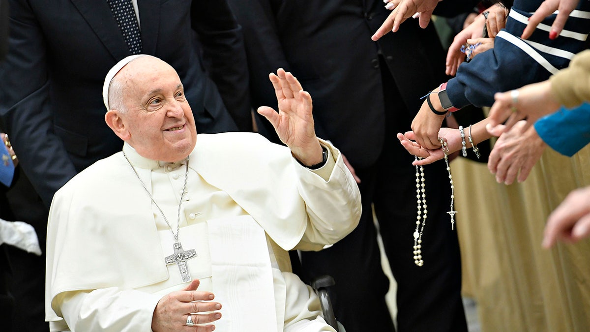 Pope Francis greets faithful