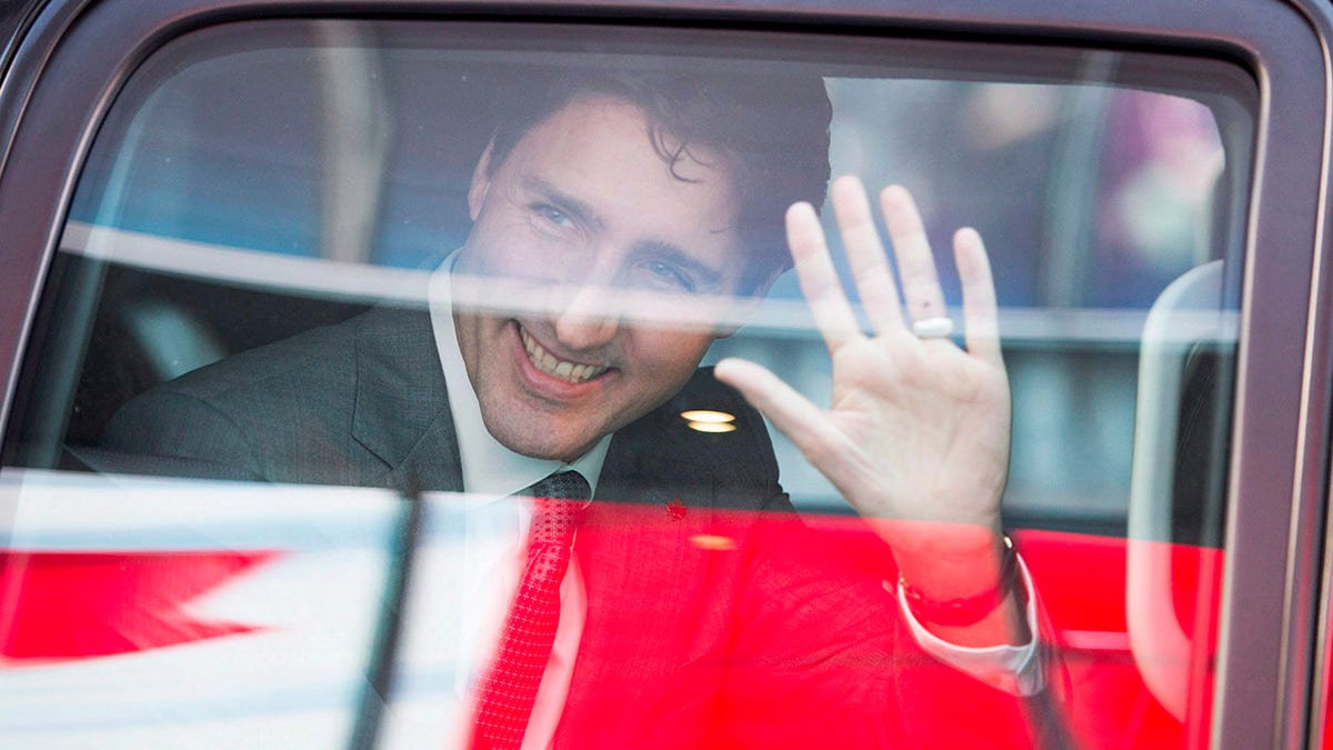 Canadian Prime Minister Justin Trudeau waves as he leaves the offices of Salesforce in San Francisco on Feb. 8, 2018.